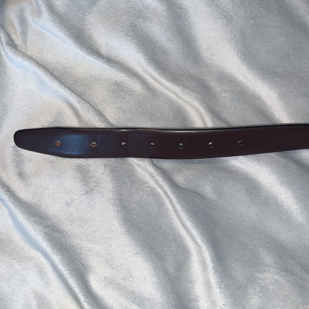 The mens warehouse smooth brown leather belt made in Italy size 38 thin dressy
